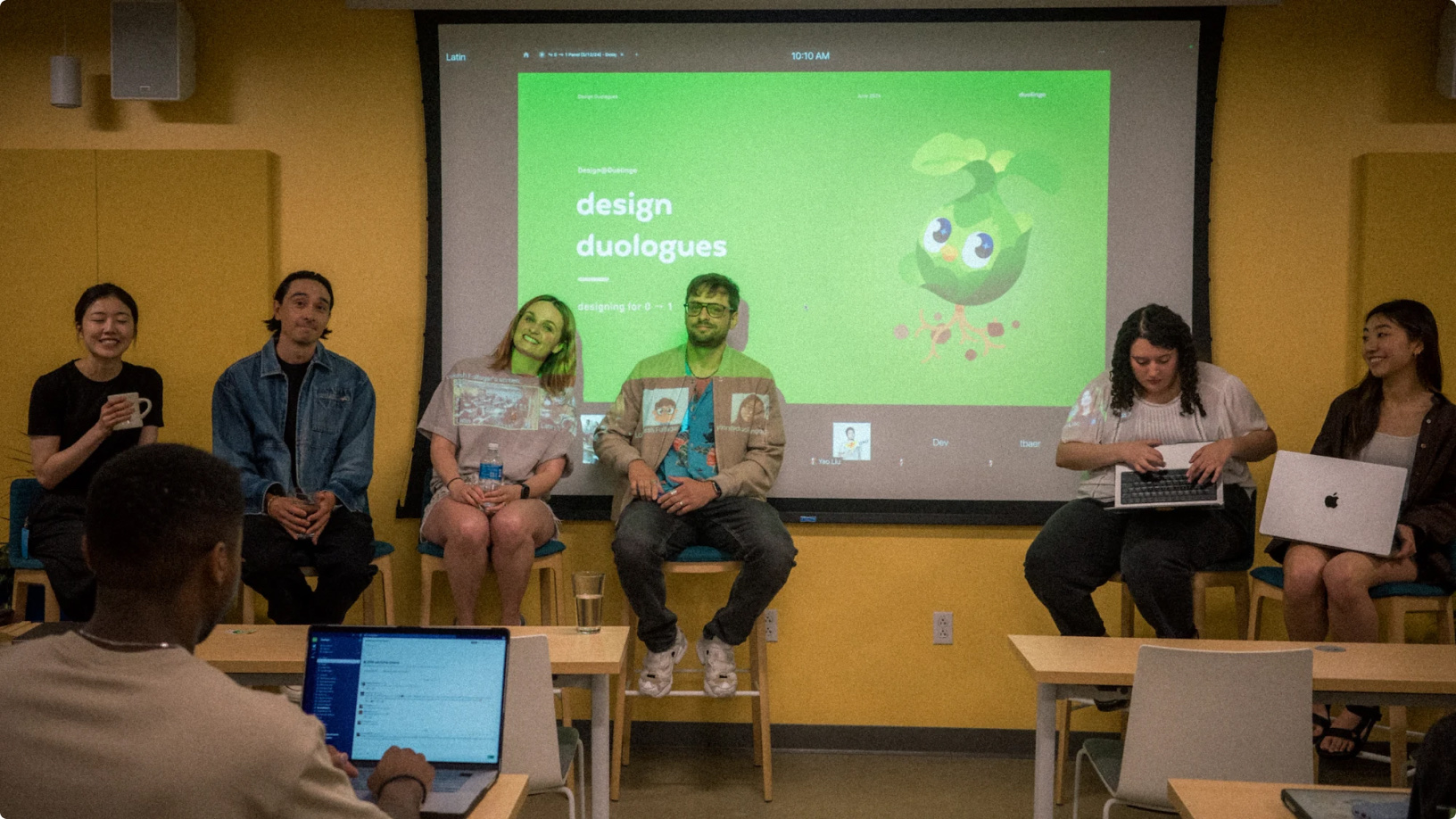 A panel of designers on stage at a Design Duologues talk.