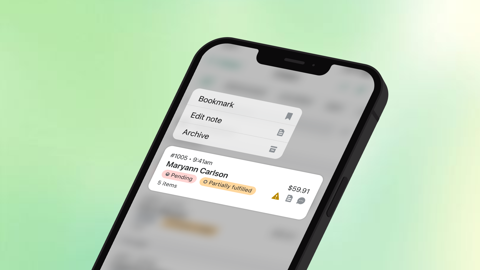A phone showing a Shopify order with a context menu open on it, offering Bookmark, Edit note and Archive.